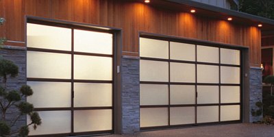 Pair of modern full-view garage doors with frosted glass